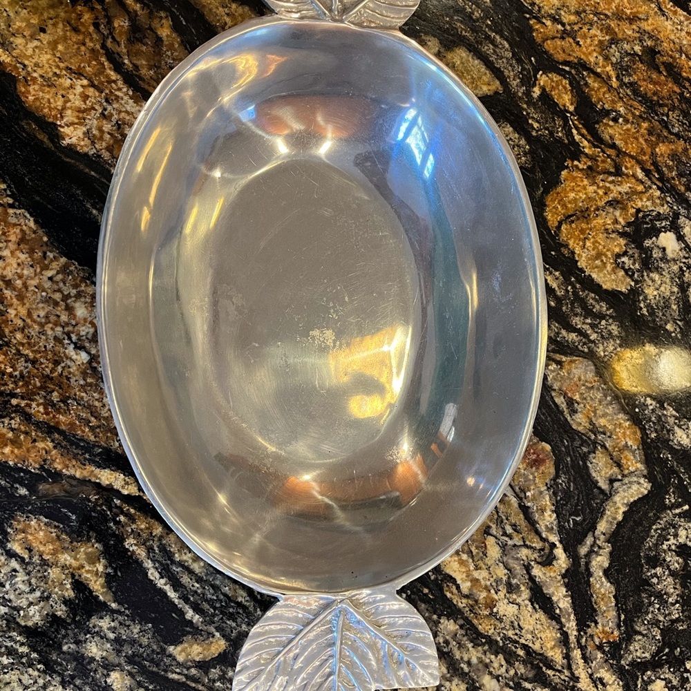 Pewter bowl with decorative handles